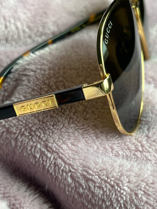 Authentic Gucci GG1163S aviator sunglasses in gold with grey lenses. main image 5